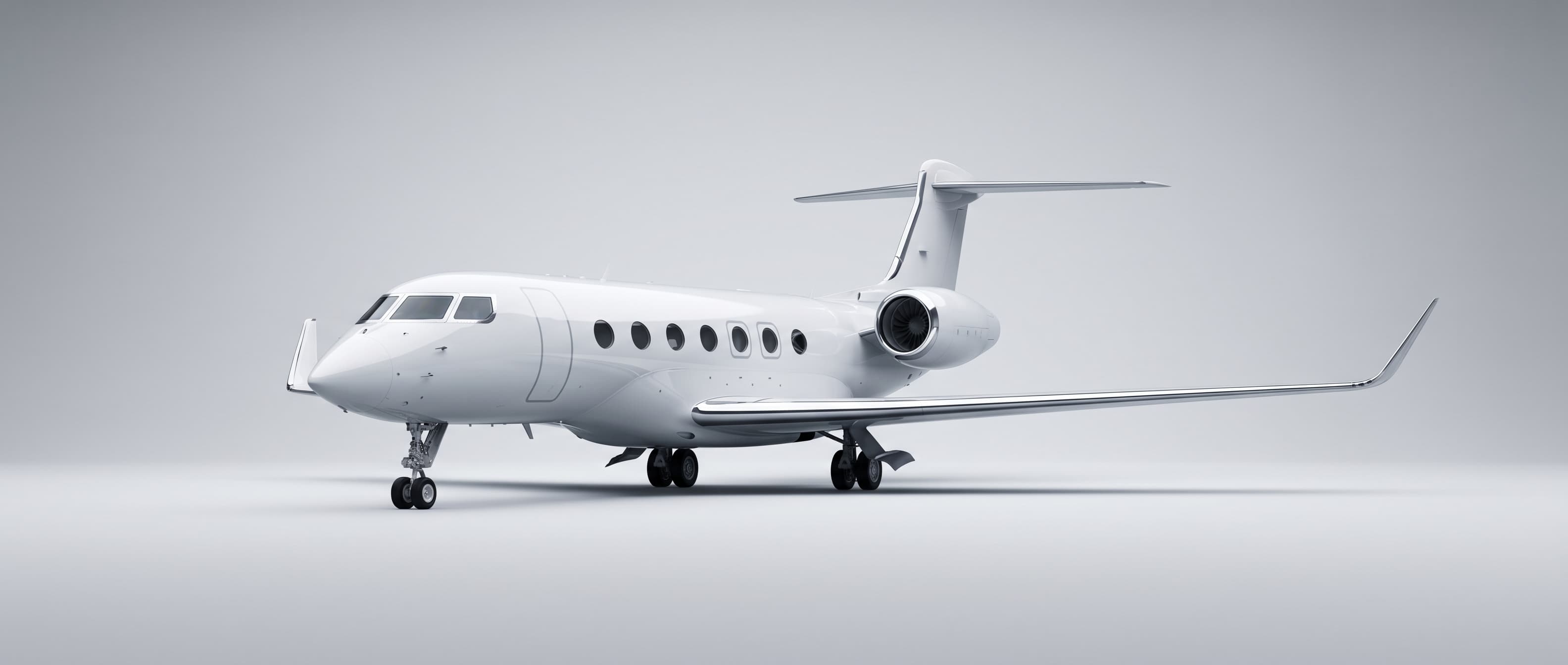 Pristine white private jet at three-quarter front angle, every panel mirror-gloss